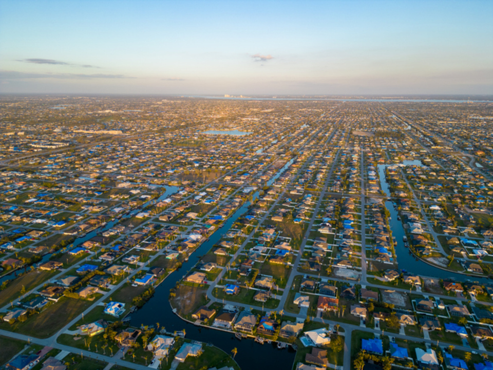 Cape Coral canal-front neighborhood with seawalls and palms